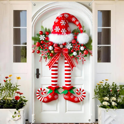 Świąteczny baner z nogami elfa na drzwiach