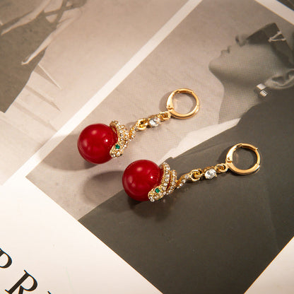 🐍Specjalna oferta noworoczna🎀 Kolczyki z pozłacanej perły w kształcie węża