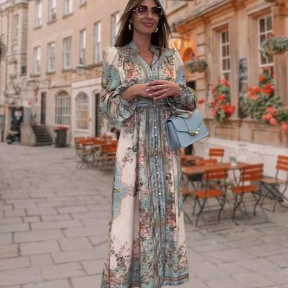 Elegancka sukienka z dekoltem w serek, wysokim stanem, kwiatowym nadrukiem i guzikami