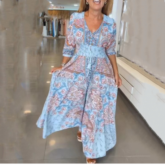 Elegancka damska sukienka z kwiatowym wzorem i długim ściągaczem