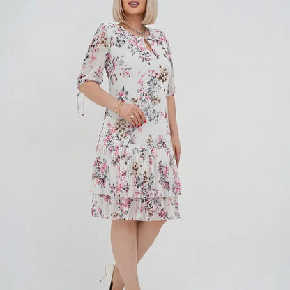 Elegancka damska sukienka plisowana z krótkim rękawem i długą spódnicą